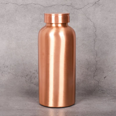 Copper water bottle close-up showing hand-hammered texture - 99.9% pure copper