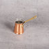 Turkish coffee pot close-up showing copper hammered texture and tin lining