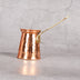 Copper ibrik cezve with Turkish coffee - traditional copper coffee pot
