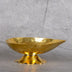 Brass oil lamp lit with warm flame - traditional diya for home decor and worship