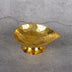 Brass diya close-up showing lotus petal design - oil lamp for puja and meditation