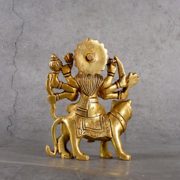 Detail of Sacred Brass Goddess Durga Idol - Artisanal Brass Hand-Hammered Texture and Quality Finish
