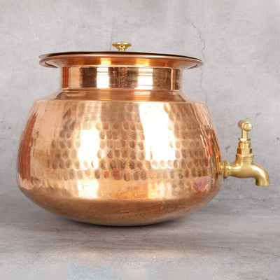 Copper matka dispenser close-up - pure copper water storage with brass tap